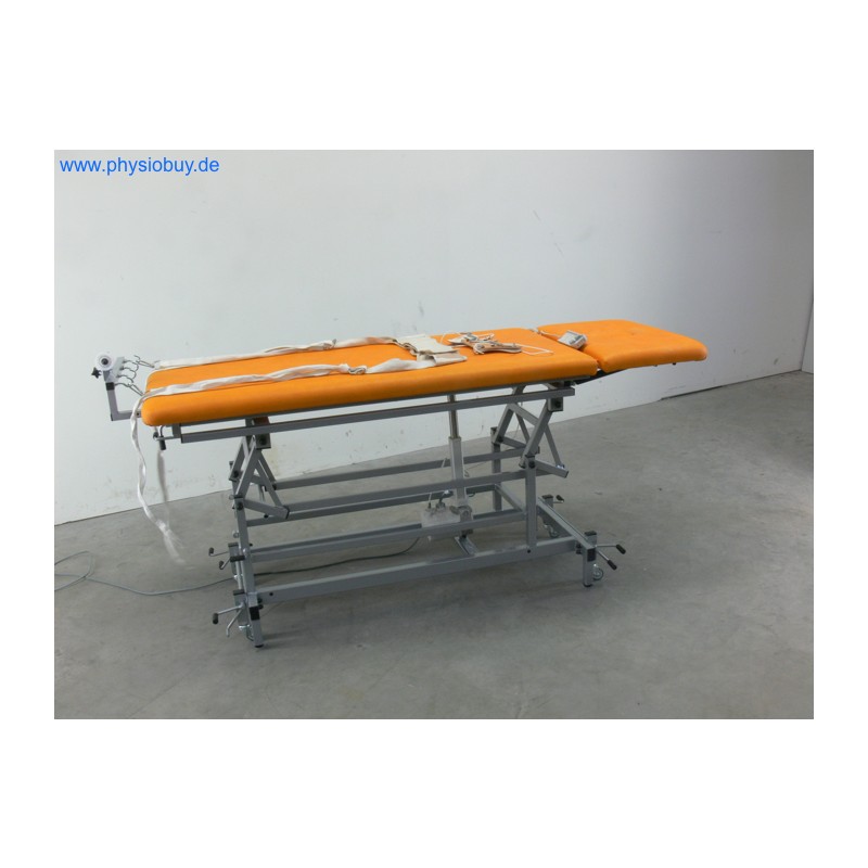 Elektrische Extensionsliege in Orange mit Fixiergurten für HWS und LWS