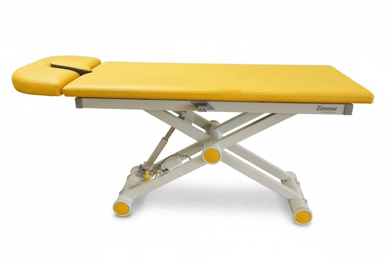 Zimmer Axion 2 Comfort Behandlungsliege mit gelbem Polster und Gesichtsaussparung