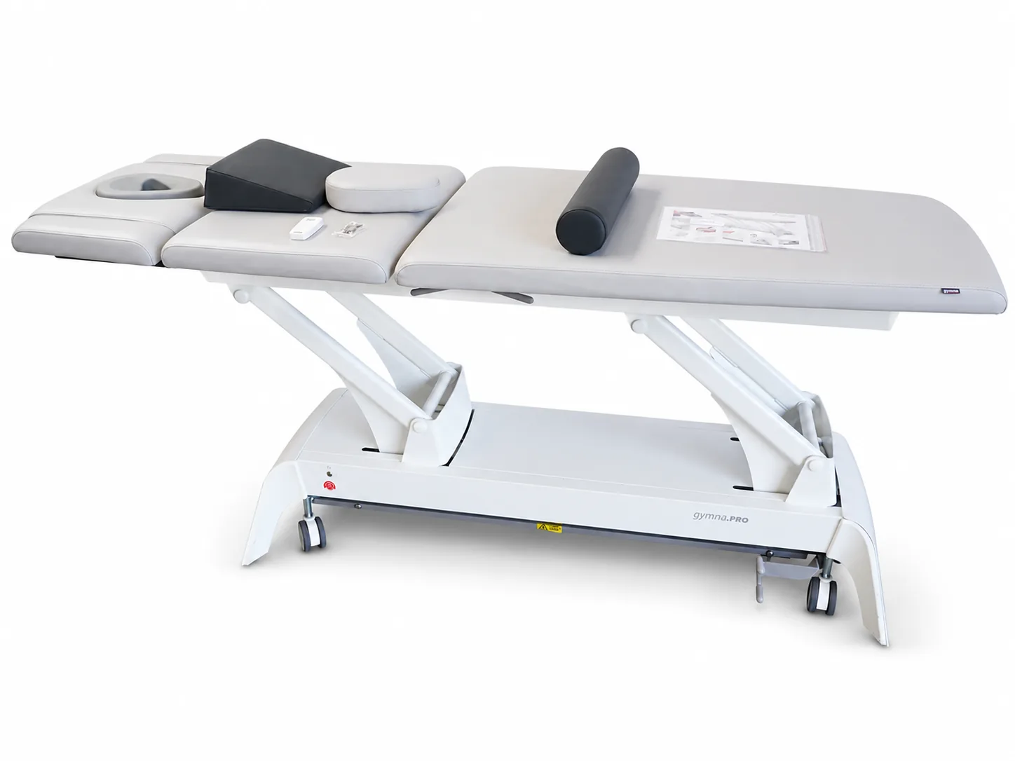 Gymna Pro T5 Therapieliege mit grauem Polster, Lagerungsrolle und Keilkissen